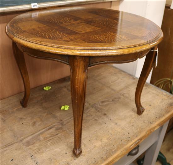 A low French oak parquetry circular topped coffee table W.63cm